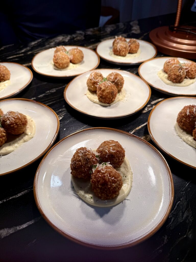 short rib arancini on a white plate